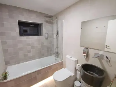 a bathroom with a toilet and a tub and a sink at VILLA MAREL in Trefacio