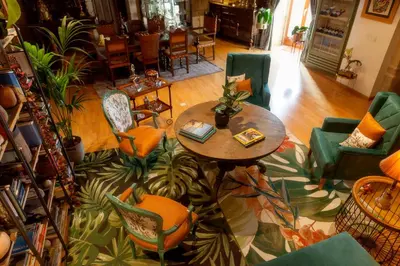 an overhead view of a living room with a table and chairs at CASA RECTORAL DE SAN EUSEBIO in Ourense