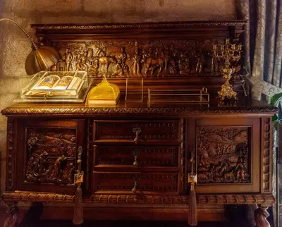 an old wooden cabinet with a painting on it at CASA RECTORAL DE SAN EUSEBIO in Ourense