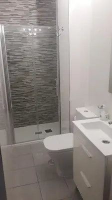 a bathroom with a shower and a toilet and a sink at Enseñanza in Ourense