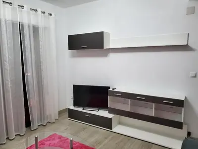 a living room with a flat screen tv on a wall at Piso termal in Ourense