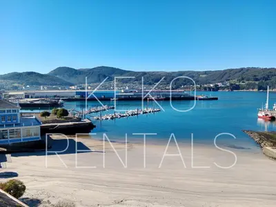 a view of a marina with boats in the water at Portbeach in Viveiro