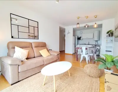 a living room with a couch and a table at Portbeach in Viveiro
