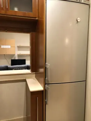 a stainless steel refrigerator in a kitchen at O recuncho in Monforte de Lemos