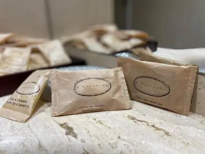 two brown bags sitting on top of a table at O recuncho in Monforte de Lemos
