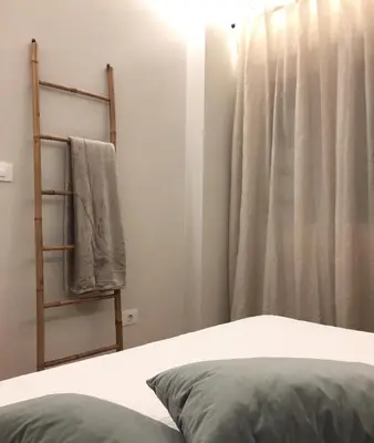 a room with a bed and a ladder and a window at Nordico in Ourense