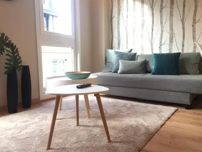a living room with a couch and a table at Nordico in Ourense