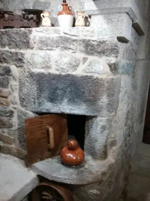 a fake stone fireplace with a donut in it at Casa Do Conde in Caldas de Reis