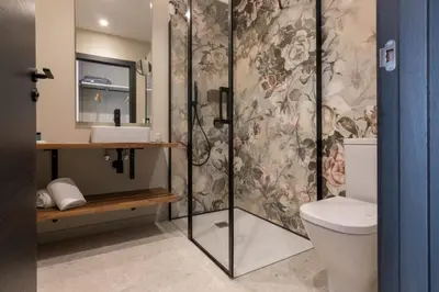 a bathroom with a shower with a sink and a toilet at Solarena Bistrot in Barreiros