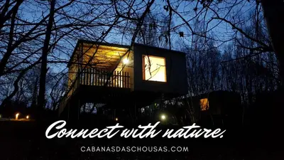 a sign that says connect with nature at night at Cabanas das Chousas in Lugo