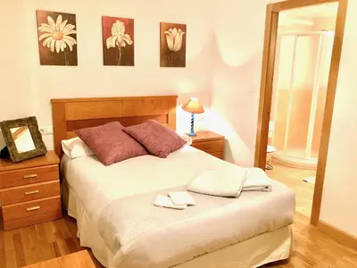 a bedroom with a bed with two towels on it at Marina Sol te hará soñar in Vivero