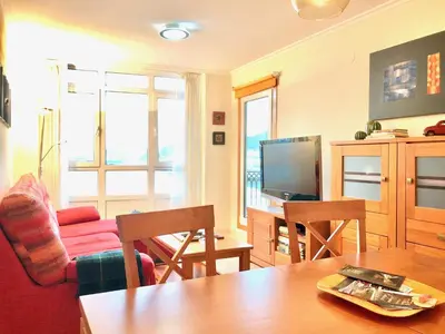 a living room with a couch and a table at Marina Sol te hará soñar in Vivero
