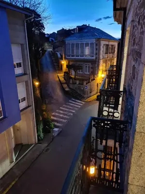 a view of a street at night from a balcony at Casa da Marquesa Sarria in Sarria