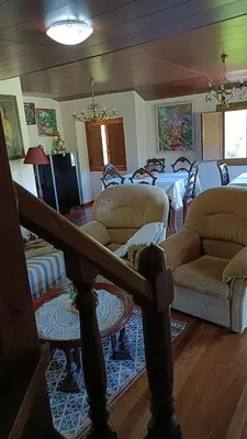 a living room with a couch and a table at Casa Quintela in Ourense