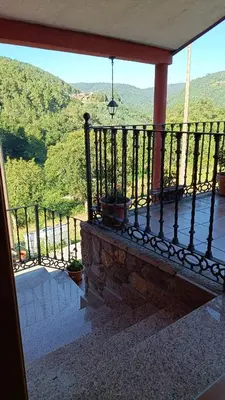 a balcony with a view of a mountain at Casa Quintela in Ourense