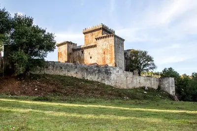 a castle on top of a hill at Casa Rural Camino Real in Melide