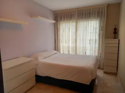 a bedroom with a white bed and a window at Piso completo en Camiño Inglés - Sigüeiro, in Sigüeiro