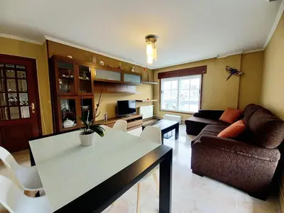 a living room with a couch and a table at Piso completo en Camiño Inglés - Sigüeiro, in Sigüeiro