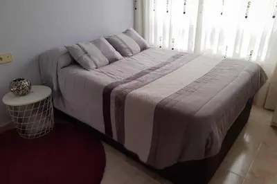 a large bed in a bedroom with a bed sidx sidx sidx at Piso completo en Camiño Inglés - Sigüeiro, in Sigüeiro