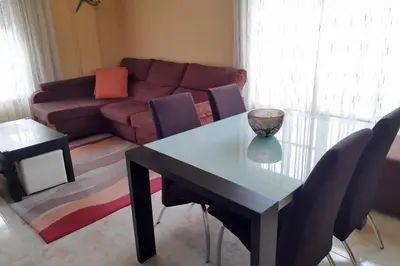 a living room with a table and a couch at Piso completo en Camiño Inglés - Sigüeiro, in Sigüeiro