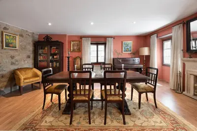 a dining room with a table and chairs at Pazo de Moreda in Sober