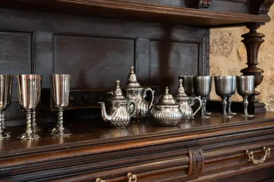 a shelf with a bunch of glasses and wine glasses at Pazo de Moreda in Sober