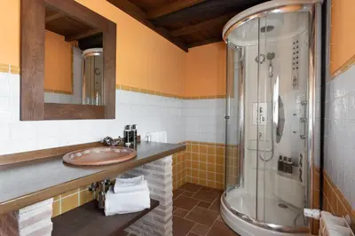 a bathroom with a sink and a shower at Pazo de Moreda in Sober