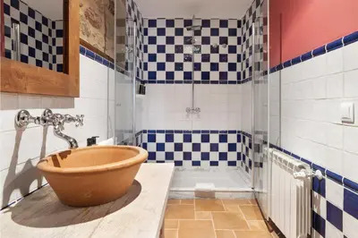 a bathroom with a tub and a sink and a shower at Pazo de Moreda in Sober