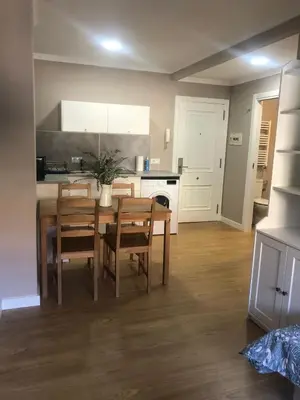 a kitchen and dining room with a table and chairs at ESTUDIO Zona Norte Santiago de Compostela VUTCO-04046 in Santiago de Compostela