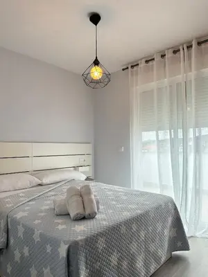 a bedroom with a bed with two towels on it at Lemos Mar in Monforte de Lemos