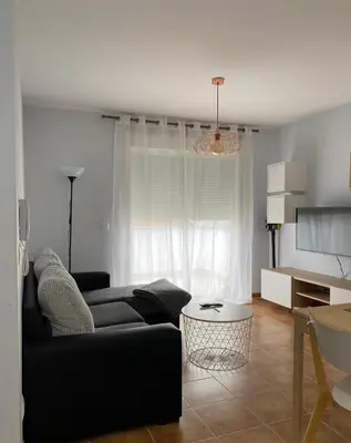a living room with a couch and a table at Lemos Mar in Monforte de Lemos