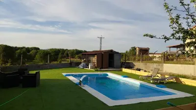 a swimming pool in the middle of a yard at Villa Peregrina in Ourense