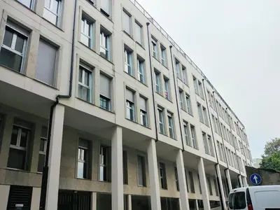 a large white building with a lot of windows at Viveiro Centro in Viveiro