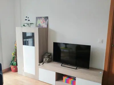 a flat screen tv sitting on top of a tv stand at Viveiro Centro in Viveiro