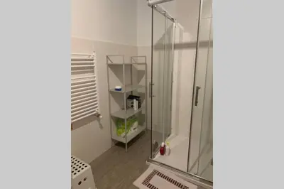 a bathroom with a shower with a glass enclosure at Casa Rural en Valadouro Serra do Xistral Lugo En medio de la Naturaleza in Lagoa