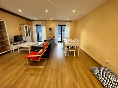 a living room with a couch and a table and chairs at Tu&Mi Villafranca in Villafranca del Bierzo