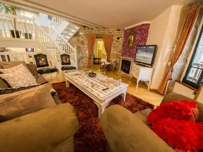a living room with a table in the middle at Mansion in Cerdedo with Private Pool and Garden in Cerdedo