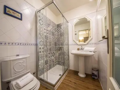 a bathroom with a shower and a toilet and a sink at Mansion in Cerdedo with Private Pool and Garden in Cerdedo