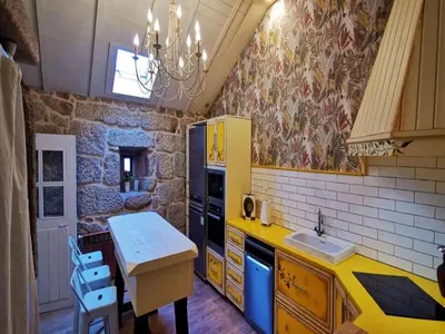 a kitchen with a yellow refrigerator and a sink at Villa in A Lama near Rías Baixas Beaches in A Lama