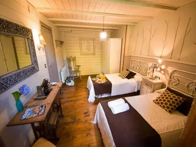 a large room with two beds and a table at Villa in A Lama near Rías Baixas Beaches in A Lama