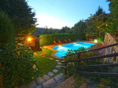 a swimming pool in a yard at night at Villa in A Lama near Rías Baixas Beaches in A Lama