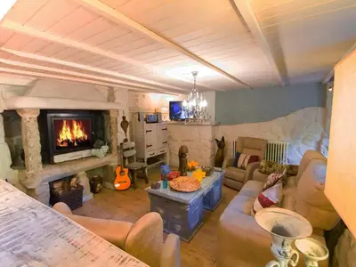 a living room with a couch and a fireplace at Villa in A Lama near Rías Baixas Beaches in A Lama