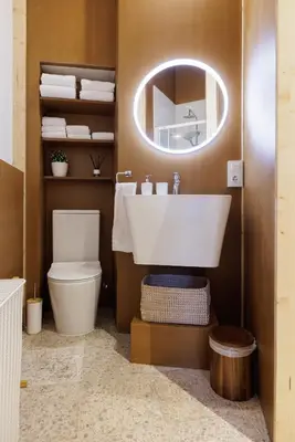 a bathroom with a sink and a toilet and a mirror at Adeinés Viviendas uso turístico in A Estrada