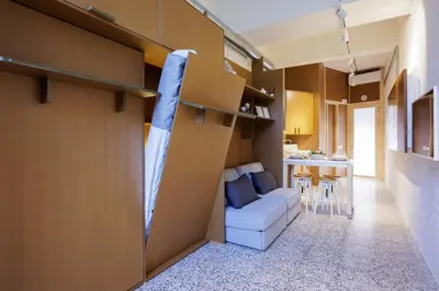 a room with a bed and a couch and a table at Adeinés Viviendas uso turístico in A Estrada