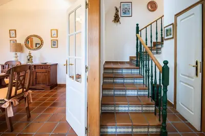 a hallway with a staircase in a house at Villa Ponte Bora in Pontevedra