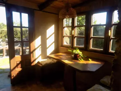 a room with windows and a table with a plant on it at Cabaña Bioxana in Molejón