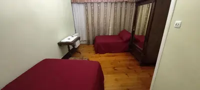 a small room with a bed and a chair at EL BORDON DE LA CASA BATALLON in Sarria