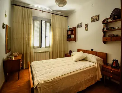 a bedroom with a bed and a window at CASA DIEGO in Monforte de Lemos