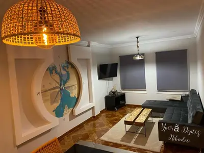 a living room with a couch and a table at Ribadeo Cantábrico Yporá Deptos in Ribadeo