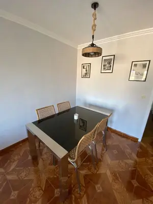 a dining room with a table and chairs at Ribadeo Cantábrico Yporá Deptos in Ribadeo